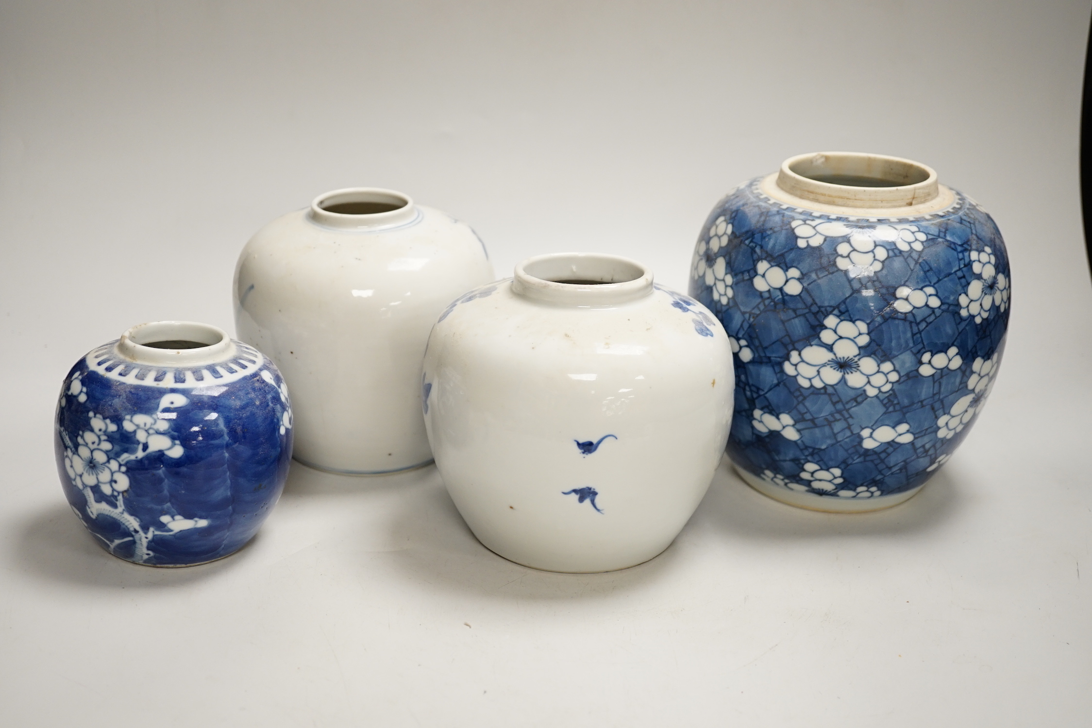 An 18th century Chinese blue and white Prunus jar and three 19th century Chinese blue and white jars, tallest 16cm